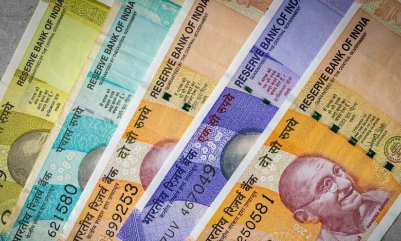 Rupee falls to 96.60 in intraday trade; settles at all-time low of 96.52 per dollar